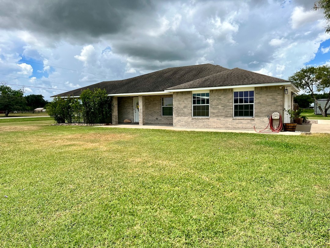 Transforming a Brick Home in Odem, TX: A Comprehensive House Wash, Sidewalk, and Driveway Cleaning